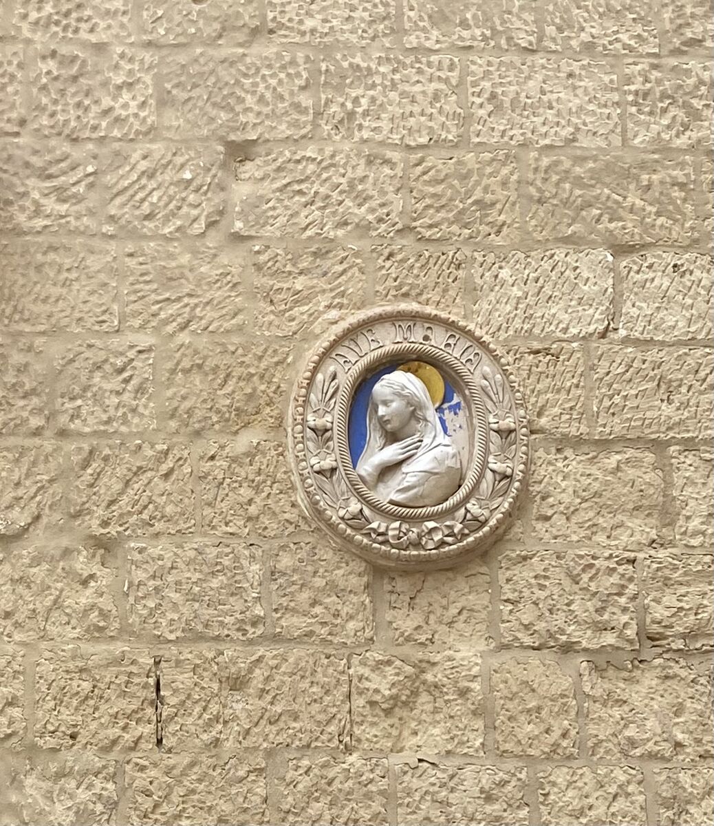 Ave Maria medallion on stone wall